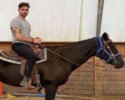 He is also a trained horse-back rider.